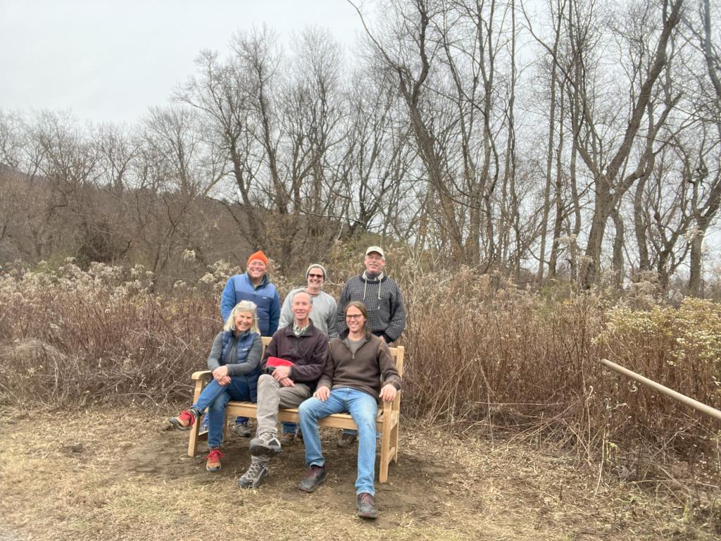 A happy team is pleased to know that visitors to the Riverfront Trail can now take a moment to sit and enjoy views of field, mountains and sky