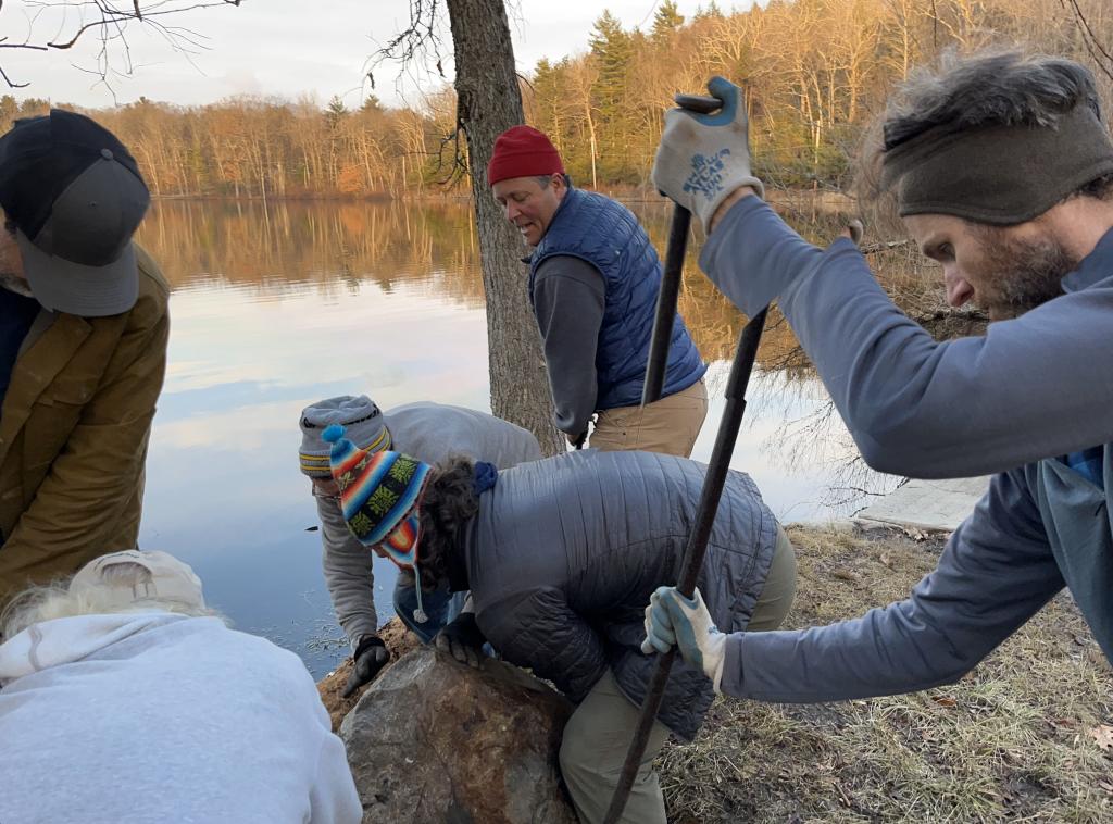 Carefully, and strategically the team coaxed the boulder to its new home,.