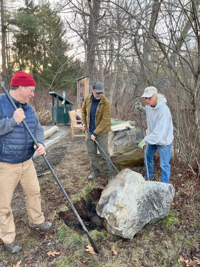 With rock bars in hand, the boulder was inched and nudges to be closer to the water.