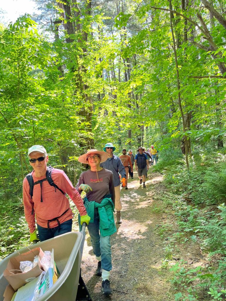 A parade of volunteers pitched at our June 1st Lake Mansfield Conservation Forest work party