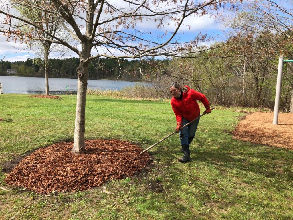 Laurie Harrison raked new mulch into place.