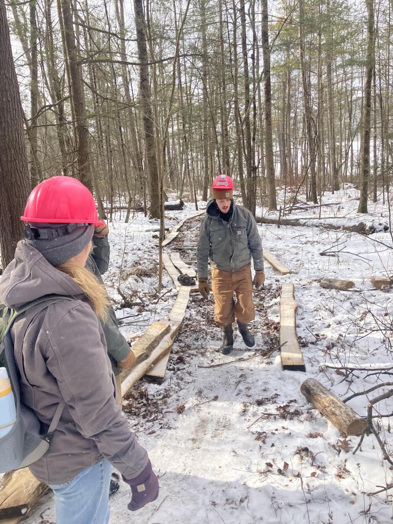 Locust is not only rot-resistant, it is heavy! Greenagers Crew, including Americorp members carried the lumber from the Pfieffer Arboretum access road