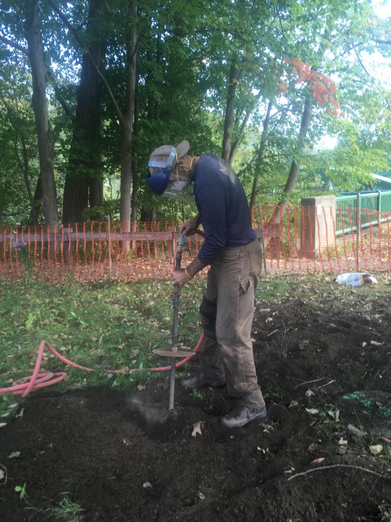 Tom Ingersoll used a pneumatic drill to aerate the severely compacted soil.