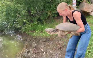 Tracy  releasing Enki into Lake Mansfield.